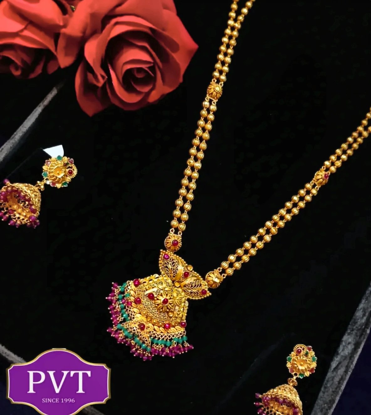 Three-layer gold chain necklace with small gold bead details and matching earrings